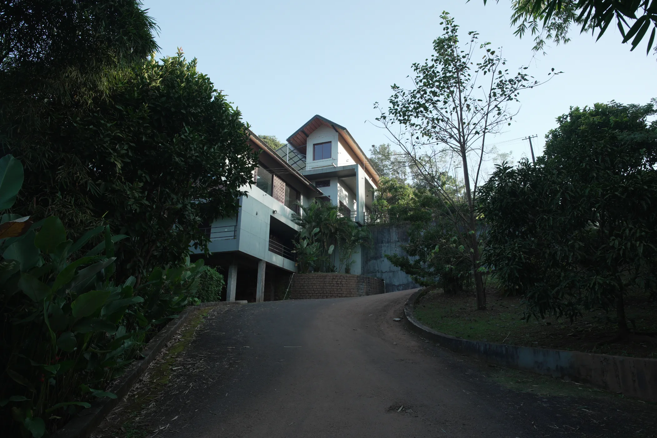 korome-campus-building-wide-view-through-trees
